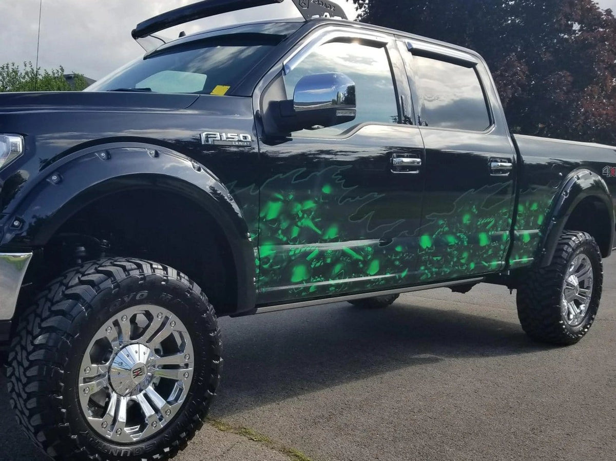 Neon green skulls wrap on black f150 truck